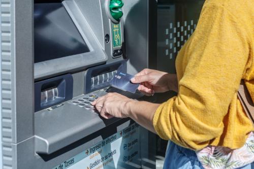 Deeezy - Woman at an ATM machine - 5 stock photos