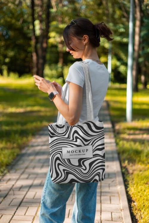 Side View Woman With Optical Print Tote Bag