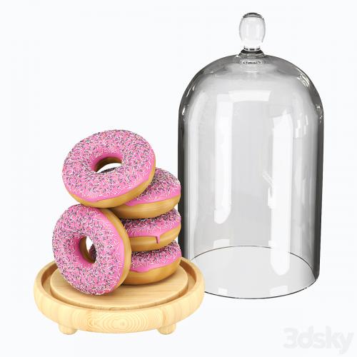 Serving dish with glass lid and donuts