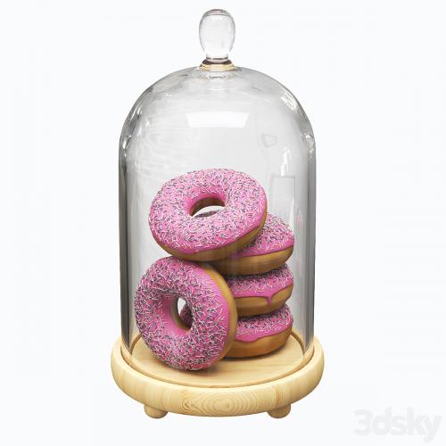 Serving dish with glass lid and donuts