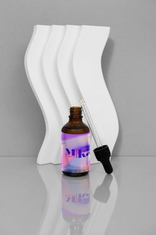 Glass Bottle With Liquid Inside Mockup