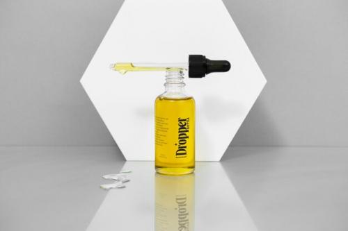 Glass Bottle With Liquid Inside Mockup