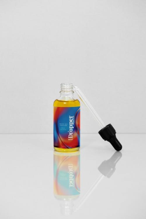 Glass Bottle With Liquid Inside Mockup