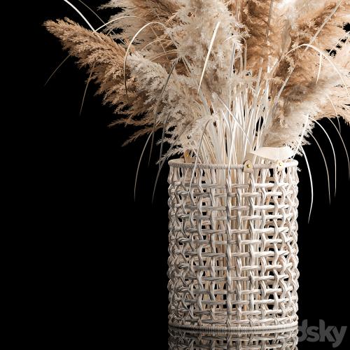 Bouquet of white dried flowers in a wicker basket, reeds, pampas grass, Cortaderia. 256.