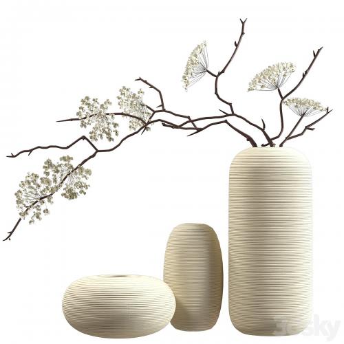 Bouquet of flowering branches in ceramic vases