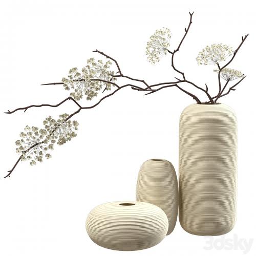 Bouquet of flowering branches in ceramic vases