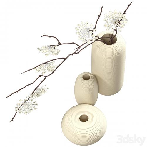 Bouquet of flowering branches in ceramic vases