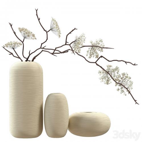 Bouquet of flowering branches in ceramic vases