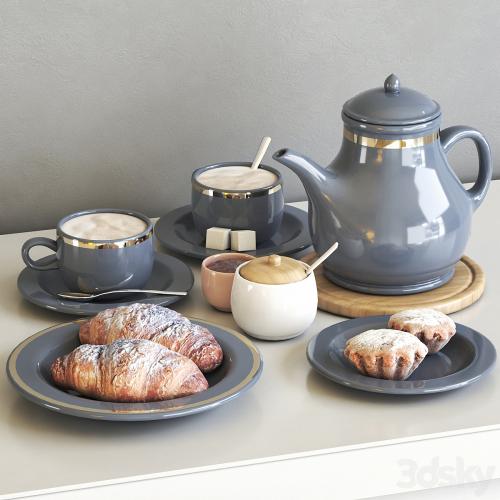 Tea set with croissant and muffin