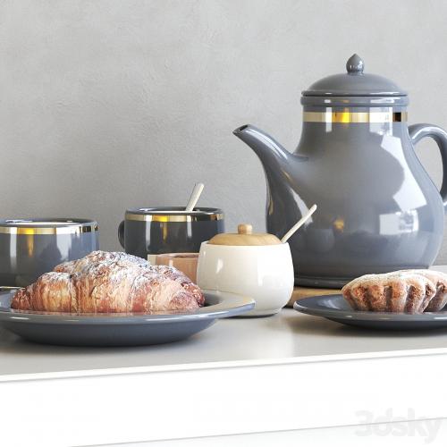 Tea set with croissant and muffin