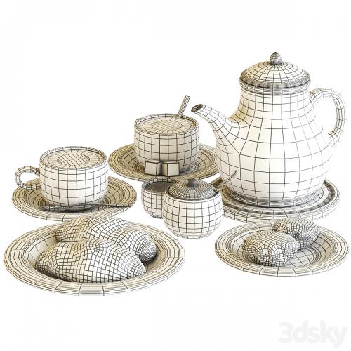 Tea set with croissant and muffin