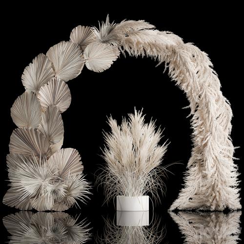 Wedding arch for decoration and decoration of the celebration with a bouquet of white pampas grass and dry palm branches