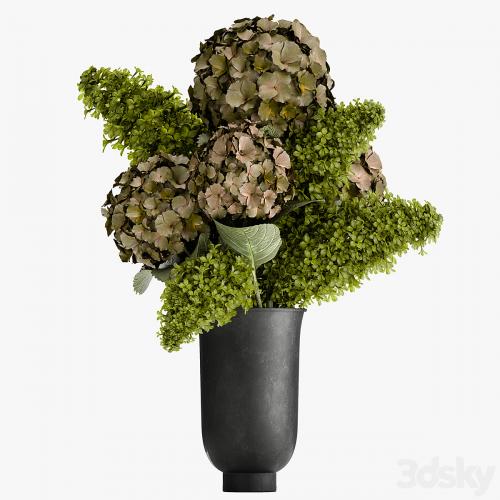 Beautiful modern bouquet of green flowers in a black vase with Hydrangea, green Lilac. 169