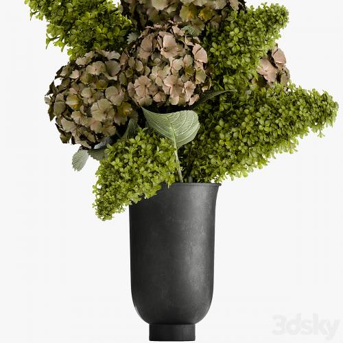 Beautiful modern bouquet of green flowers in a black vase with Hydrangea, green Lilac. 169