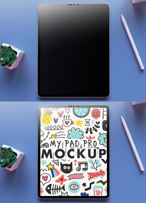 My Pad Pro Tablet Mockup on a Clean Blue Desk and a Succulent Flower on Over the Head View - 473801612