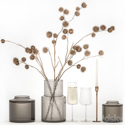 Bouquet of dried flowers from thorn branches burdock with a vase and a glass of sparkling wine. 253