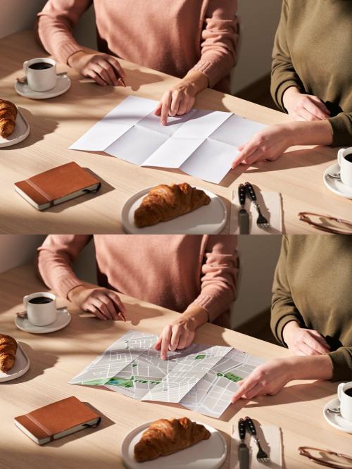 Two Women Looking at a Mockup Map in a Café