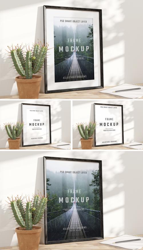 Black Frame Mockup on Wooden Desk