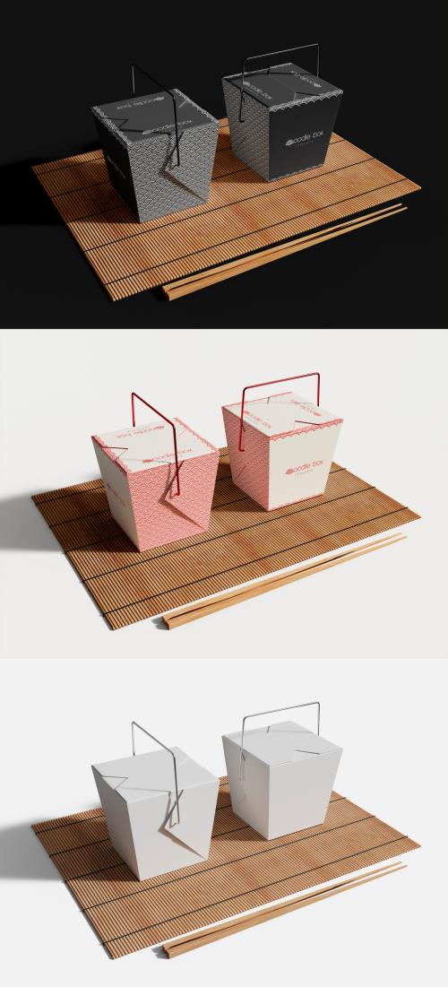 Noodle Boxes with Chopsticks on a Bamboo Mat