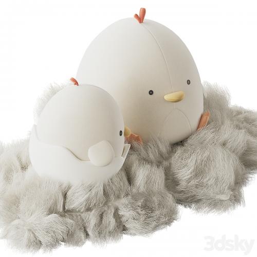 Cute plush chickens in a nest