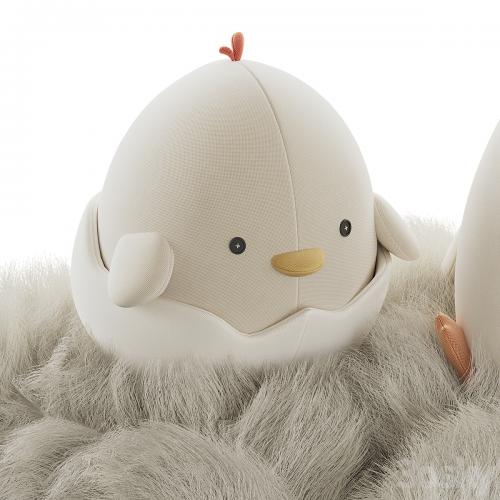 Cute plush chickens in a nest