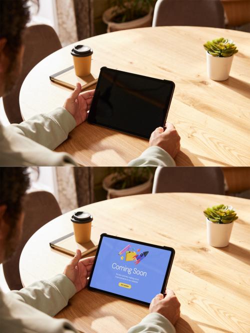 Man Holding a Tablet Mockup on Table