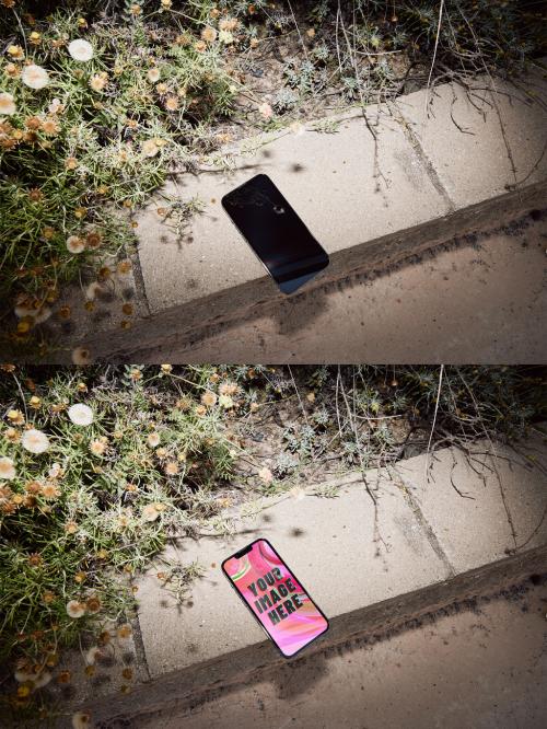 Mockup of a Smartphone on a Concrete Wall with Plants