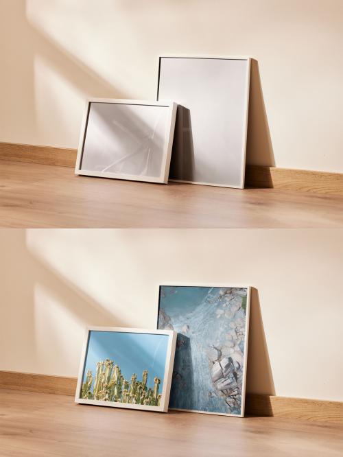 Group of Two Picture Frames Lean on a Wall
