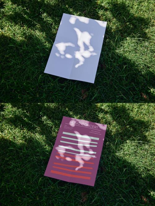 Vertical A2 Poster Mockup Over Green Grass With Sunlight Shadows