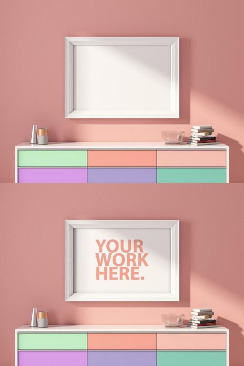 Horizontal White Poster Frame Mockup Hanging Above Colorful Chest on Pink Wall