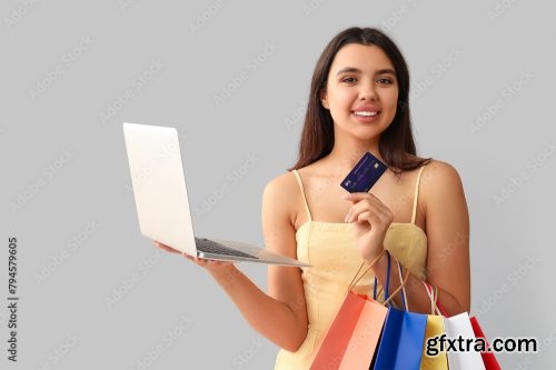 Young Woman With Credit Card Paying 6xJPEG