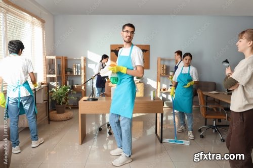 Group Of Young Janitors Cleaning In Office 6xJPEG