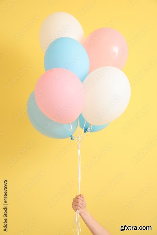 Hand With Air Balloons On Color Background 6xJPEG