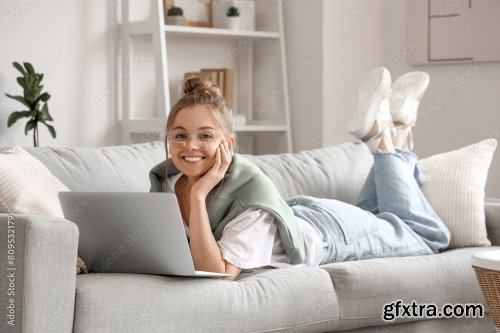 Young Woman Sitting At Workplace And Working With Laptop In Living Room 6xJPEG