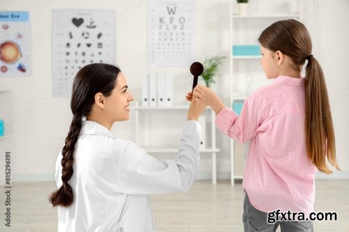 Female Ophthalmologist Checking Little Girl 6xJPEG