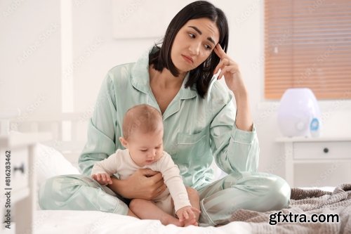 Young Woman With Her Baby Suffering From Postnatal Depression 6xJPEG