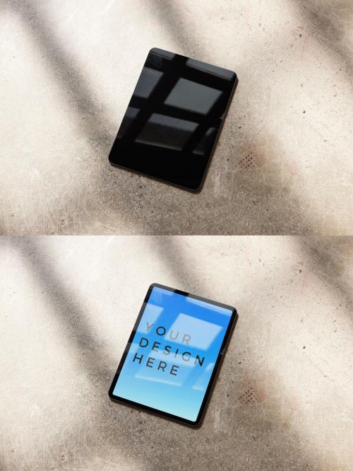 Vertical Smart Tablet Mockup on a Concrete Floor With Window Light