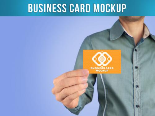 Business Card Mockup with Man Holding In Hand