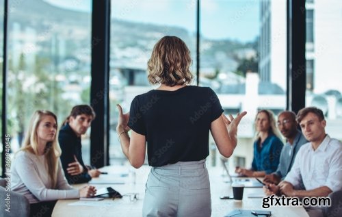 Group Of Business Professionals In A Productive Discussion At A Conference Meeting 4xJPEG