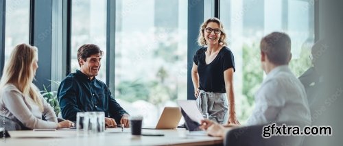 Group Of Business Professionals In A Productive Discussion At A Conference Meeting 4xJPEG