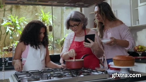 Brazilian Mother And Daughter In The Kitchen Decorating A Cake For Mother\'s Day 3xJPEG