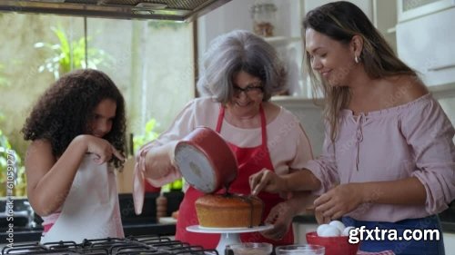 Brazilian Mother And Daughter In The Kitchen Decorating A Cake For Mother\'s Day 3xJPEG