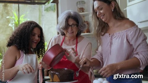 Brazilian Mother And Daughter In The Kitchen Decorating A Cake For Mother\'s Day 3xJPEG