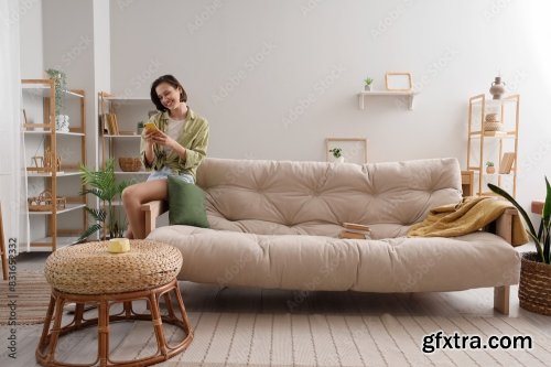 Young Pretty Woman Sitting On Sofa In Living Room 6xJPEG