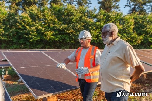 Latin Farmer Talking With The Technician Who Installed Photovoltaic Panels On His Farm In Brazil 6xJPEG