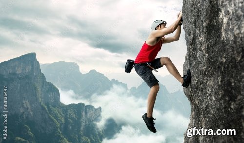 Asian Man Rock Climber In Black Pants Climbing On The Cliff 6xJPEG