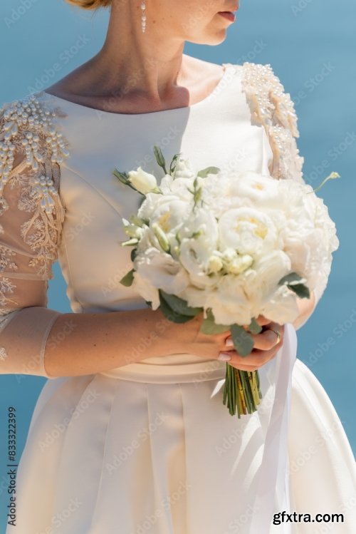 A Woman Is Holding A Bouquet Of Pink And White Flowers 6xJPEG