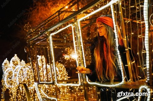 Woman Holding Sparkler Night While Celebrating Christmas Outside 6xJPEG