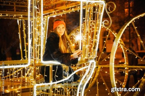 Woman Holding Sparkler Night While Celebrating Christmas Outside 6xJPEG