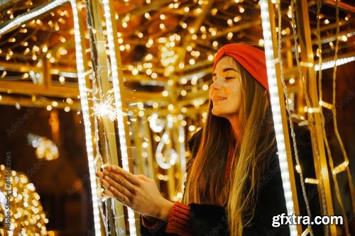 Woman Holding Sparkler Night While Celebrating Christmas Outside 6xJPEG